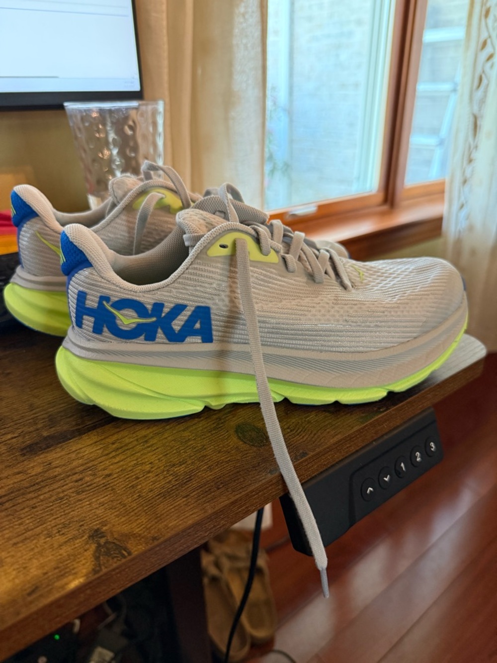 Kid’s Hoka Clifton 9 running shoes in a grey, cobalt blue, neon yellow, sz 4.5